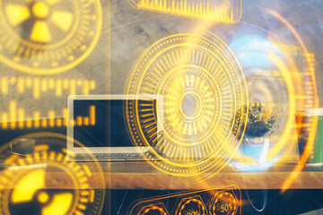 Computer on desktop in office with technology theme hologram. Multi exposure. Tech concept.