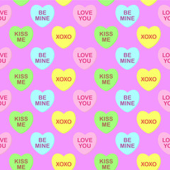 Seamless cute colorful vector valentine pattern with pastel candy hearts with text on pink background. Gift wrapping paper, interior, cloth, fabric or web design.