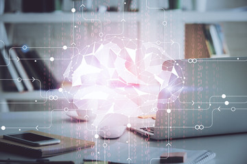 Double exposure of work table with computer and brain sketch hologram. Brainstorming concept.