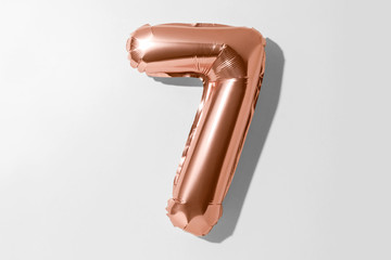 Number 7, Rose gold foil balloon number seven isolated on a white background with Clipping Path