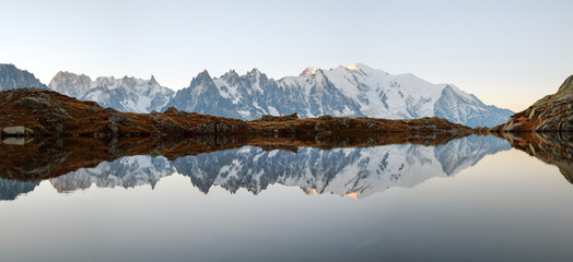 Picturesque panorama of Chesery lake (Lac De Cheserys) and snowy Monte Bianco mountains range on background, Chamonix, France Alps