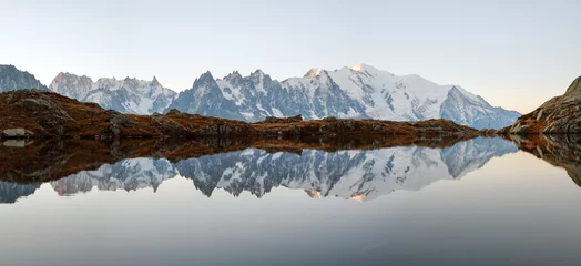 Fotobehang Bergen Picturesque panorama of Chesery lake (Lac De Cheserys) and snowy Monte Bianco mountains range on background, Chamonix, France Alps  © Ivan Kmit
