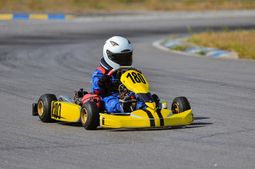 Young go cart racer on circuit