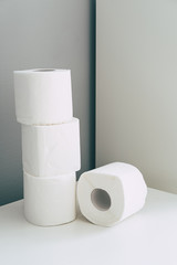 Stack of toilet paper rolls in isometric style in grey and white colors. Coronavirus infection. Pandemic panic concept. Still life trend.