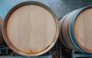 resting wooden barrels of wine in the wine cellar