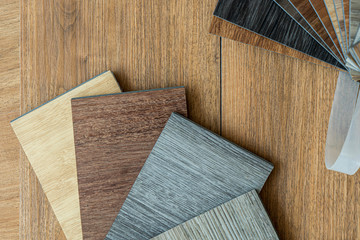 Obraz na płótnie Canvas luxury vinyl floor tile collection : sample stack of vinyl tiles on composition space 