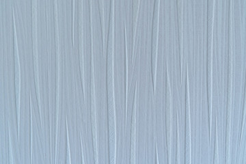 Fototapeta premium Photo texture of non woven wallpaper in a icy blue color with elevations.