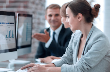 business team discussing financial charts on a workplace