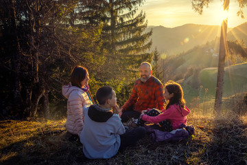 Family picnic in the countryside.