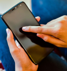Close up of a woman using smart phone 