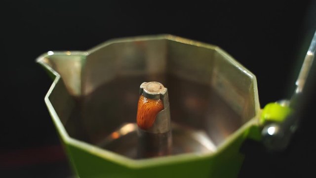 Hot coffee that flows out of the moka pot