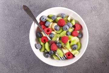 mixed fruit salad with blueberry, raspberry, kiwi and banana