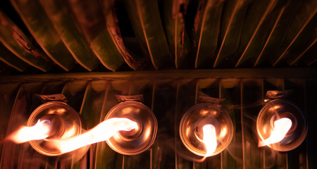 Traditional Malay kerosene oil lamps at night. Selective focus.