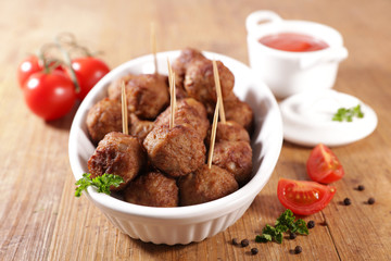 fried meatball with tomato sauce