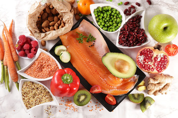 health food assortment with fruit, vegetable, fish, cereal