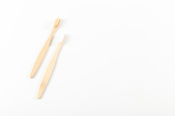 Toothbrushes made of eco materials, natural wood. On white background.