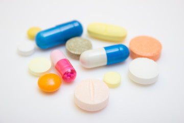Many tablets and capsules, white background - protection quarantine, coronavirus, covid19