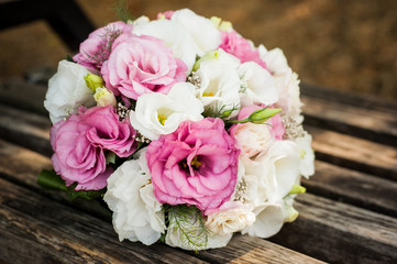 the bride’s bouquet on the day of the wedding is very delicate beautiful together with wedding rings