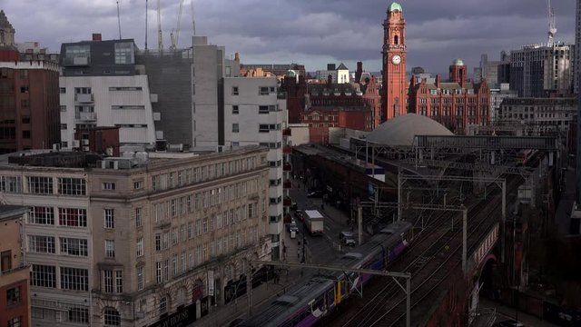 Manchester city aerial view trams and trains UK 4K
