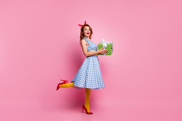 Full length photo of excited crazy lady get dream package big giftbox hold impressed scream wow omg wear blue dress yellow stockings isolated over pink color background