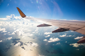 Fototapeta premium Wing of an airplane. Photo applied to tourism operators and fast and efficient transportation. picture for add text message or art work frame website. Traveling concept.