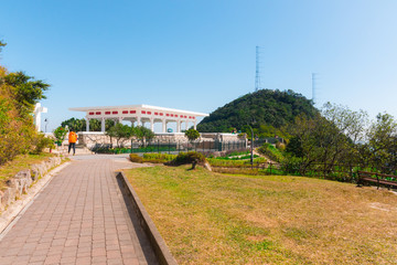 Victoria Peak Gardens. Pavilion built on the site of the former Mountain Lodge (an alternate residence for the Governor of Hong Kong). Beautiful sunny day with a mountain in the background.