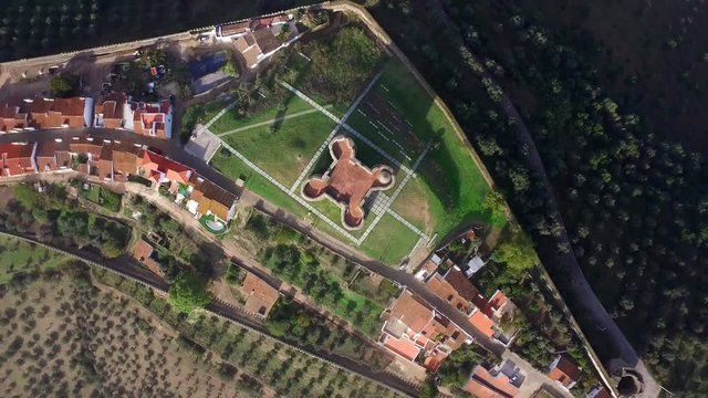 Inside Evoramonte castle walls.Portuguese castle located in Alentejo. Clover tower aerial drone top shot .