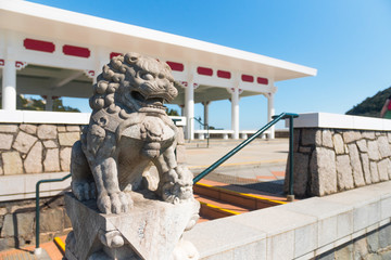 Naklejka premium Beautiful Lion stone statue, Victoria Peak Gardens. Pavilion built on the site of the former Mountain Lodge (an alternate residence for the Governor of Hong Kong). Symbol of power.