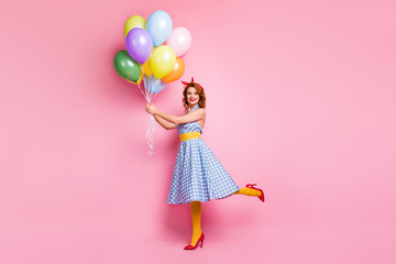 Full length photo of positive fifty style vogue lady fun walk hold many colorful bright air baloons...