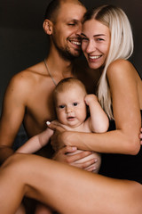 family, mother, father and children, sons, at home, warm family relationships, hug, kiss children, enjoy life together, games with the whole family, stay home