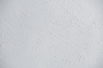 Light gray (grey) wall background with embossed abstract pattern