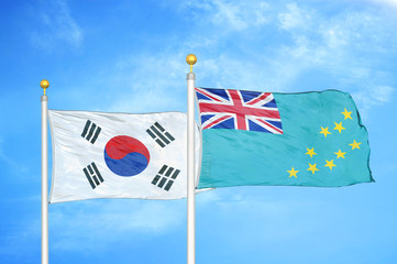 South Korea and Tuvalu two flags on flagpoles and blue cloudy sky