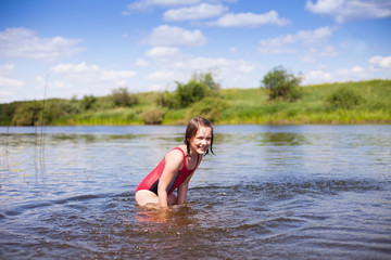 Girl  swimming in   warm river.