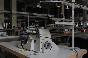 sewing machine in a large sewing shop, factory