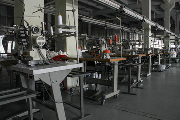 sewing machine in a large sewing shop, factory