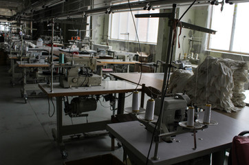 sewing machine in a large sewing shop, factory