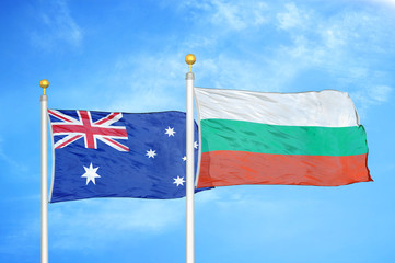 Fototapeta premium Australia and Bulgaria two flags on flagpoles and blue cloudy sky
