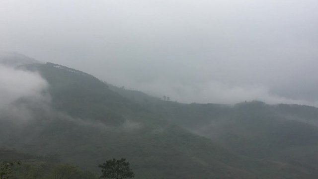 Mountains in the north of Vietnam covered by heavy clouds on the top and mist on the bottom