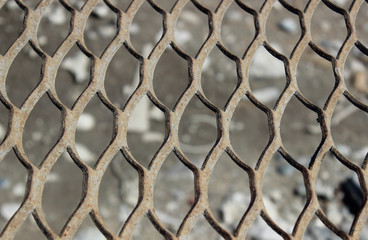 Fototapeta premium Decorative metal mesh with traces of rust