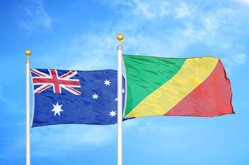 Australia and Congo two flags on flagpoles and blue cloudy sky