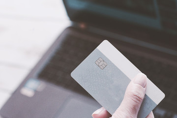 woman holding credit card - online shopping concept