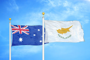 Fototapeta premium Australia and Cyprus two flags on flagpoles and blue cloudy sky