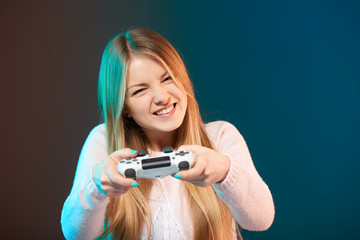 Funny happy woman playing video game with joystick © paffy
