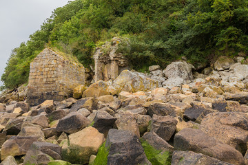 Mont Saint Michel, France. The ruins of medieval buildings on the shore
