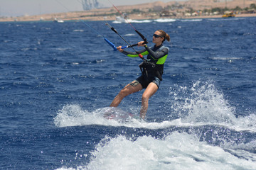 Girl kitesurfing