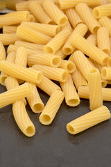 Rigatoni Italian dry pasta, selective focus.