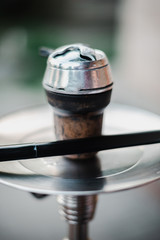 Obraz premium Metal hookah on a summer terrace with a blurred background