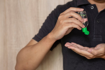 using hand sanitizer gel cleaning hands at home