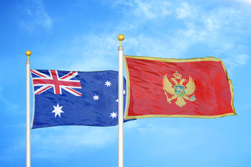Australia and Montenegro two flags on flagpoles and blue cloudy sky