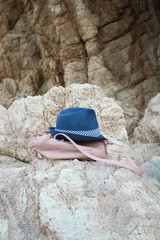 Hat and rucksack laying on the stone